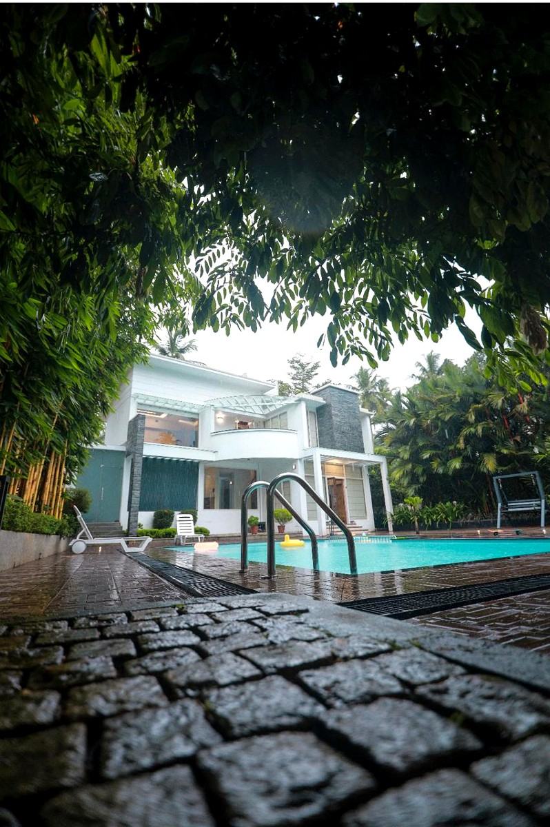 Garden path leading to the pool through tropical greenery